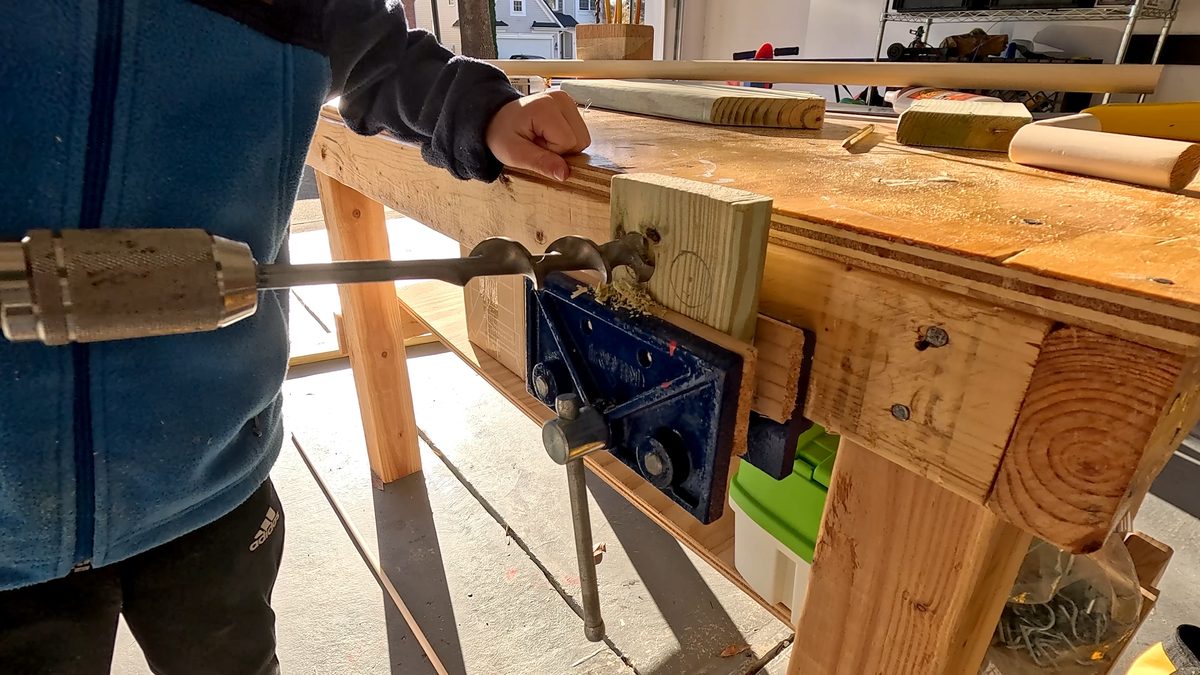 Drilling holes for smoke stack.