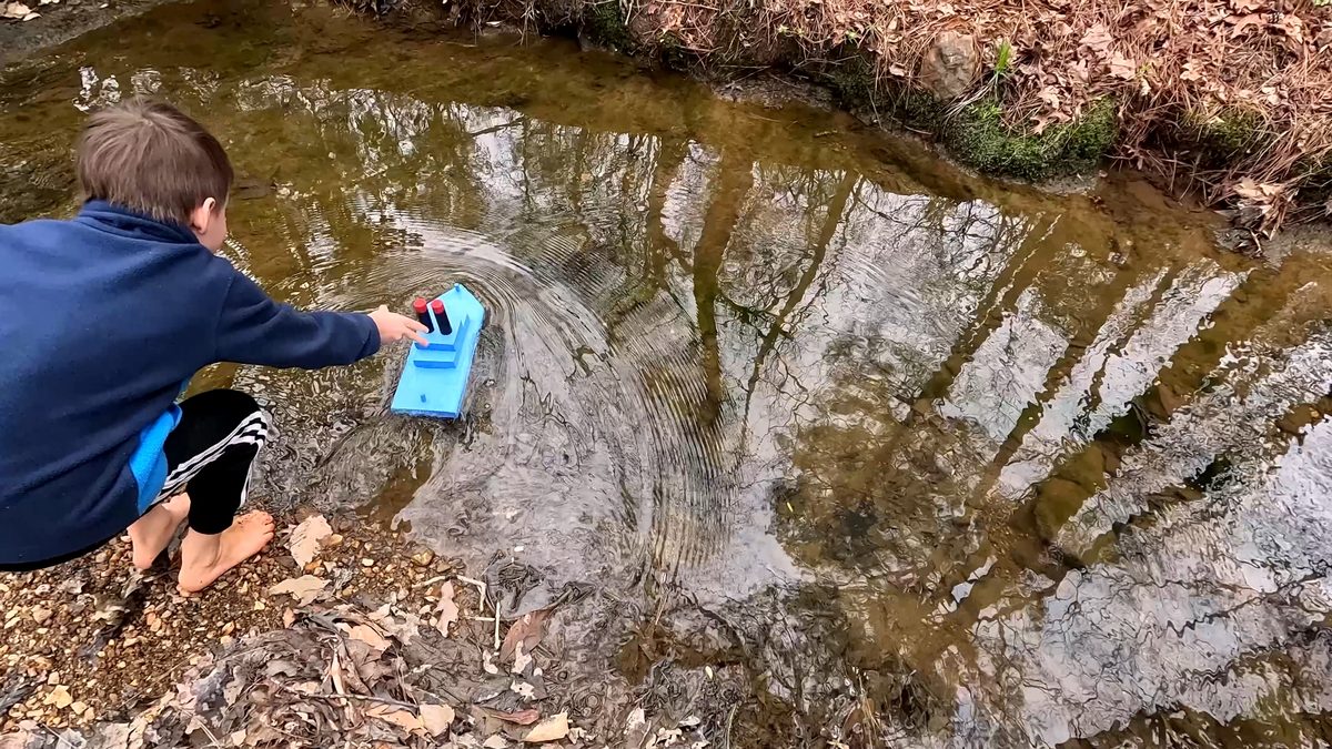 Testing the boat in a stream