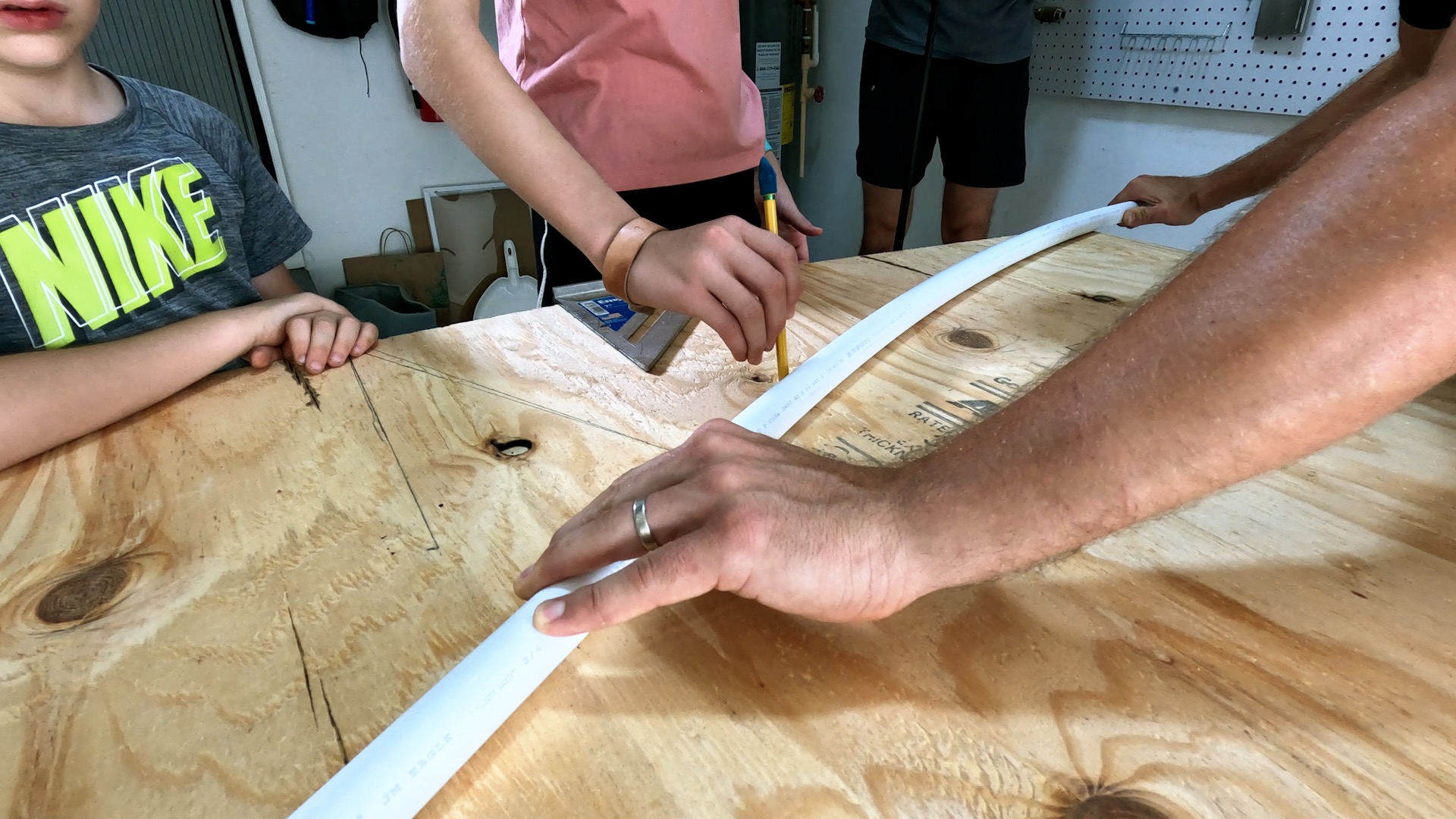 Tracing profile of jump ramp on plywood with PVC