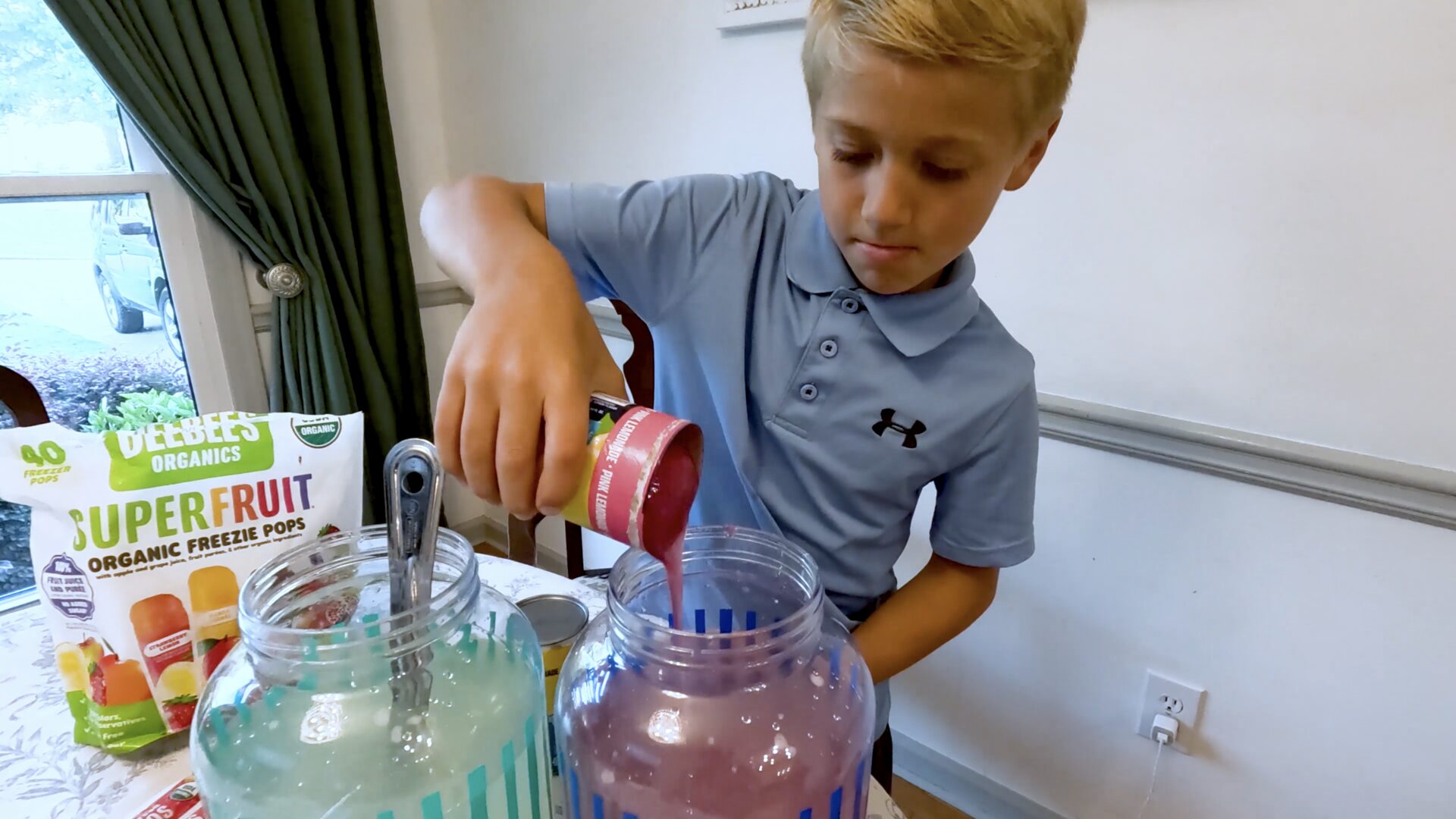 Kid mixes lemonade from concentrate
