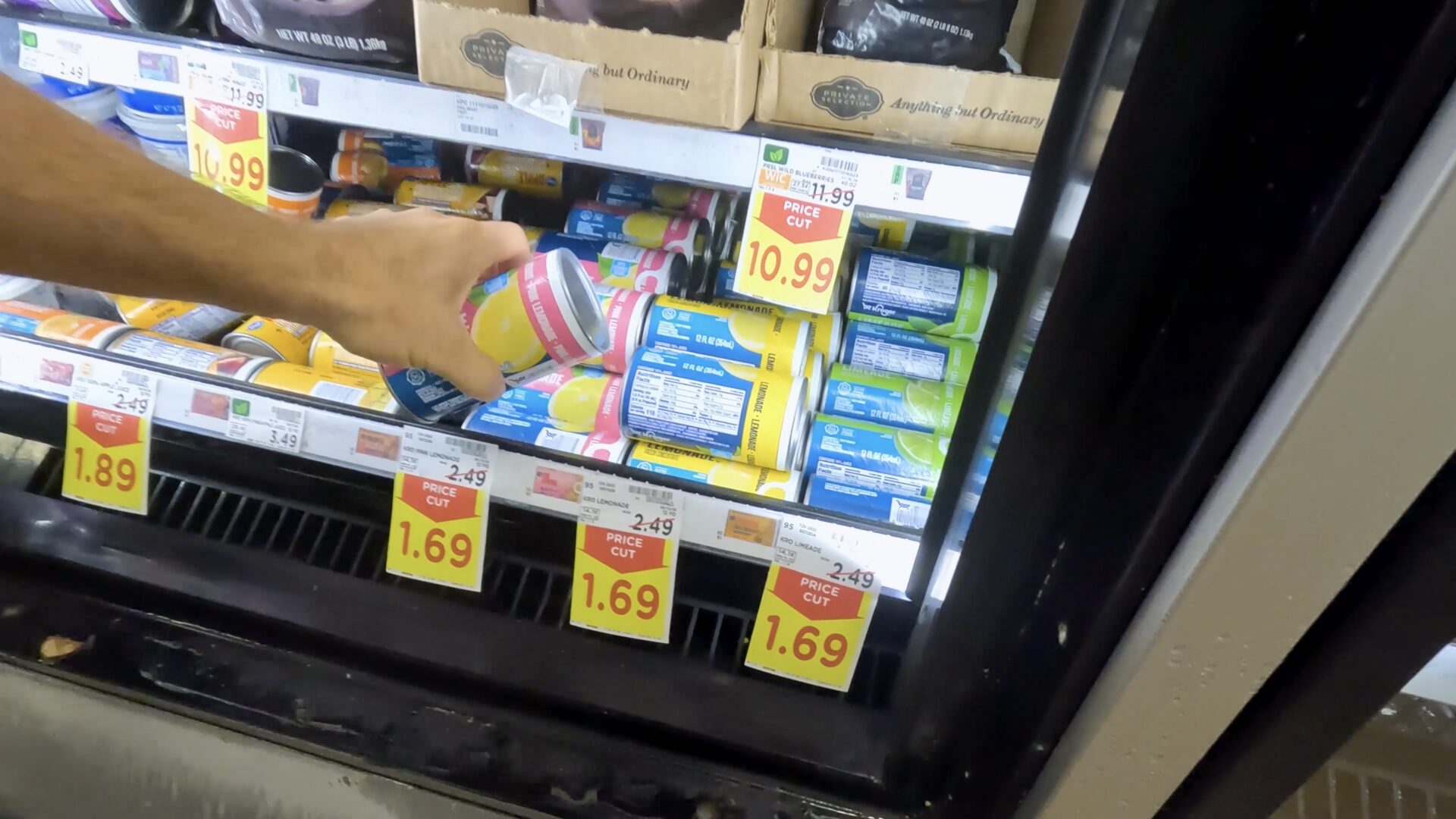 Buying lemonade concentrate from the store.