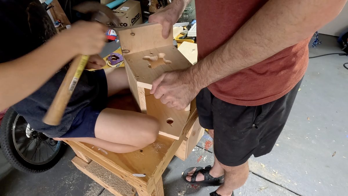 Nailing the bird house together