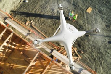 Drone taking aerial photos on the construction site