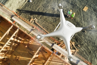Drone flying above a construction site.