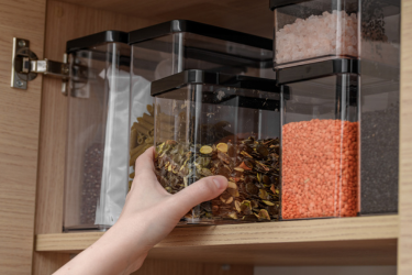 Containers with grains on the pantry