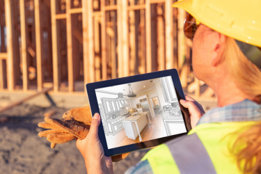 Woman using a 3D Modeling software during construction