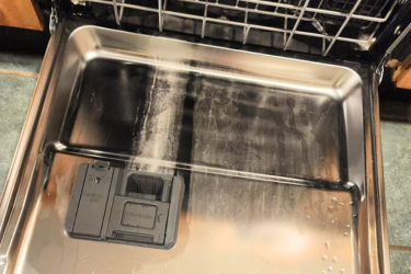 Dishwasher with hard water build up in the door