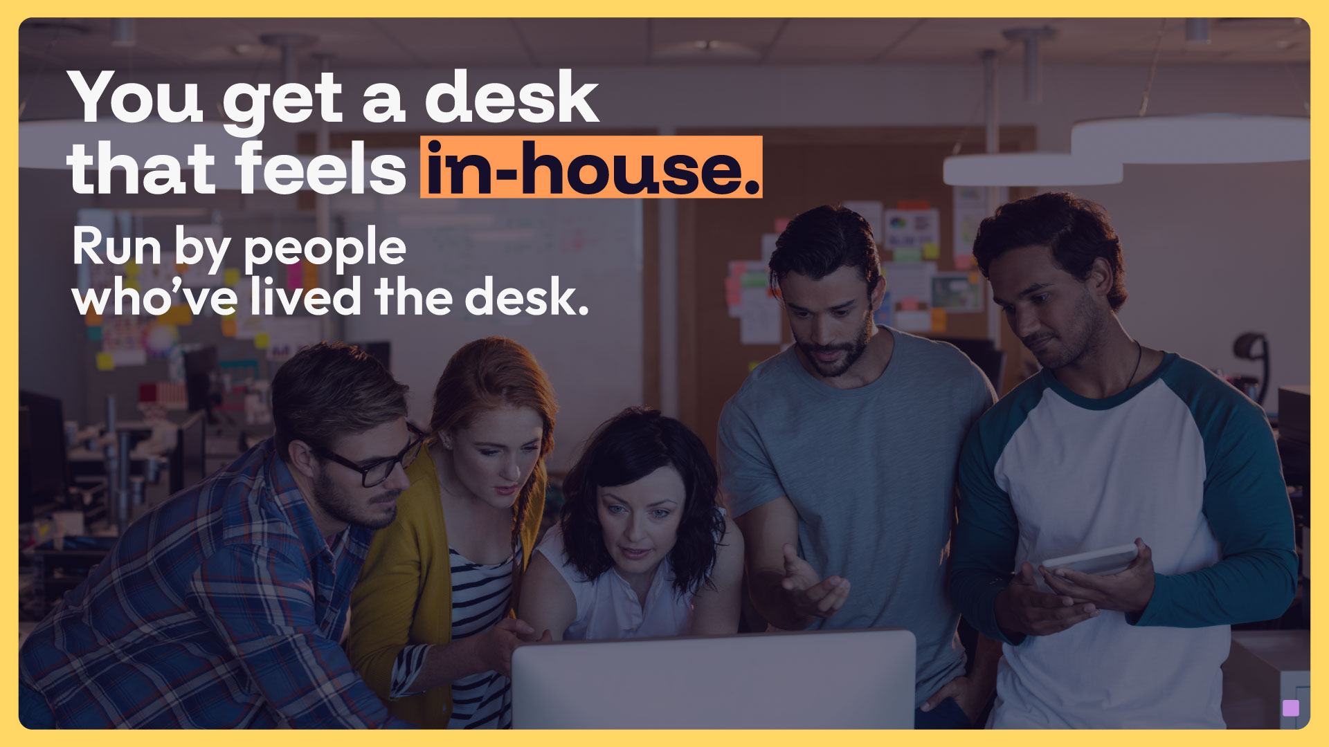 OutSight campaign visual — team collaborating at a laptop with the headline "You get a desk that feels in-house. Run by people who've lived the desk."
