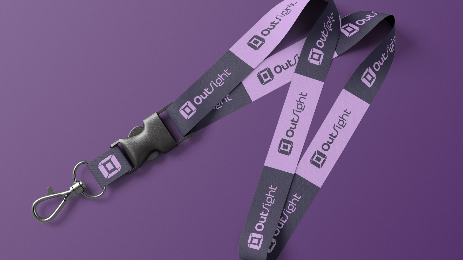OutSight branded lanyard in dark gray and purple with repeated logo and wordmark
