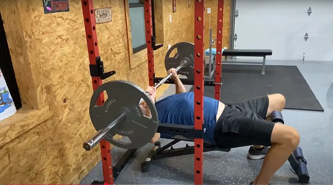 man working out - How Much Does A Bench Press Bar Weigh