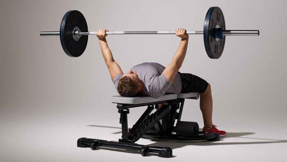 man on a bench press machine - Average Bench Press Kg By Age