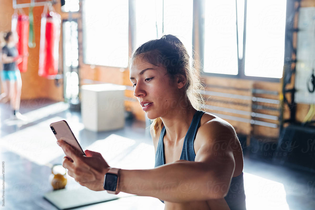 woman wearing a fitness watch - Best Workout Tracker App