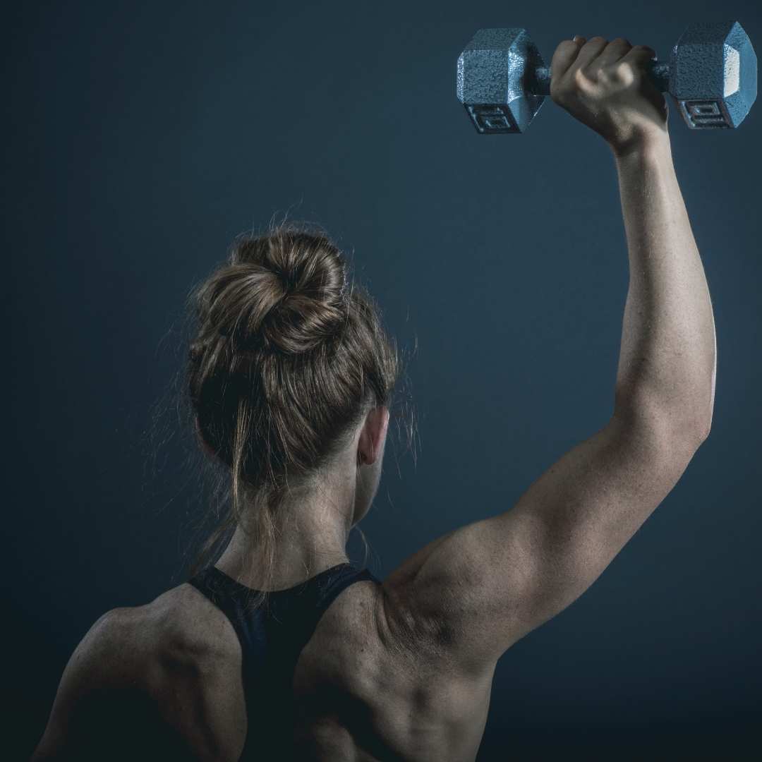 woman holding a dumbbell - Arms Workout Women