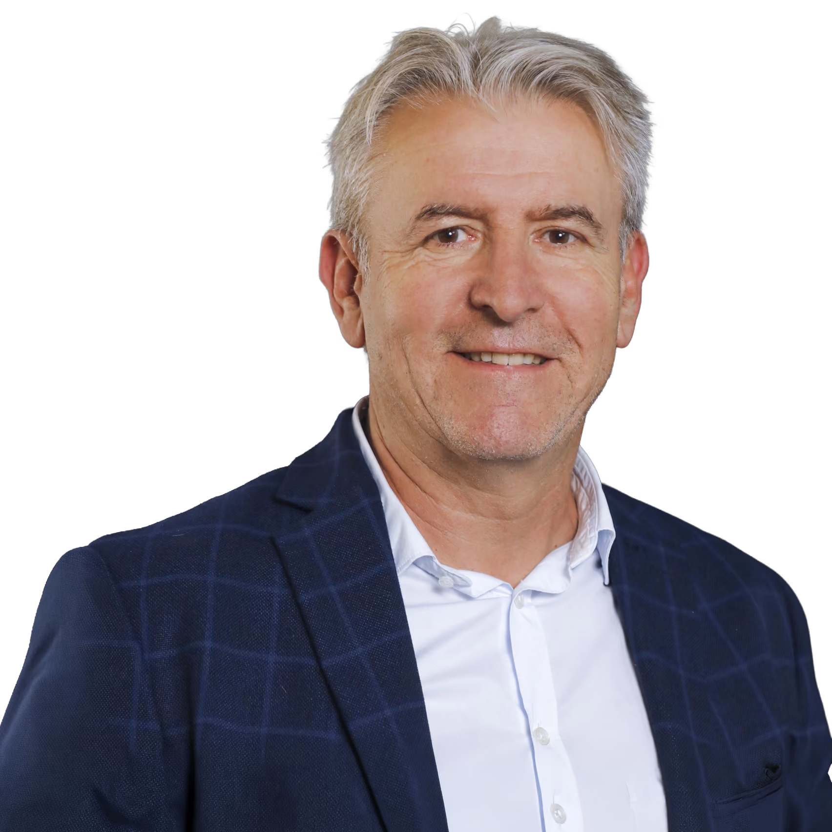 Smiling middle-aged man with gray hair wearing a blue plaid blazer and white shirt on black background.