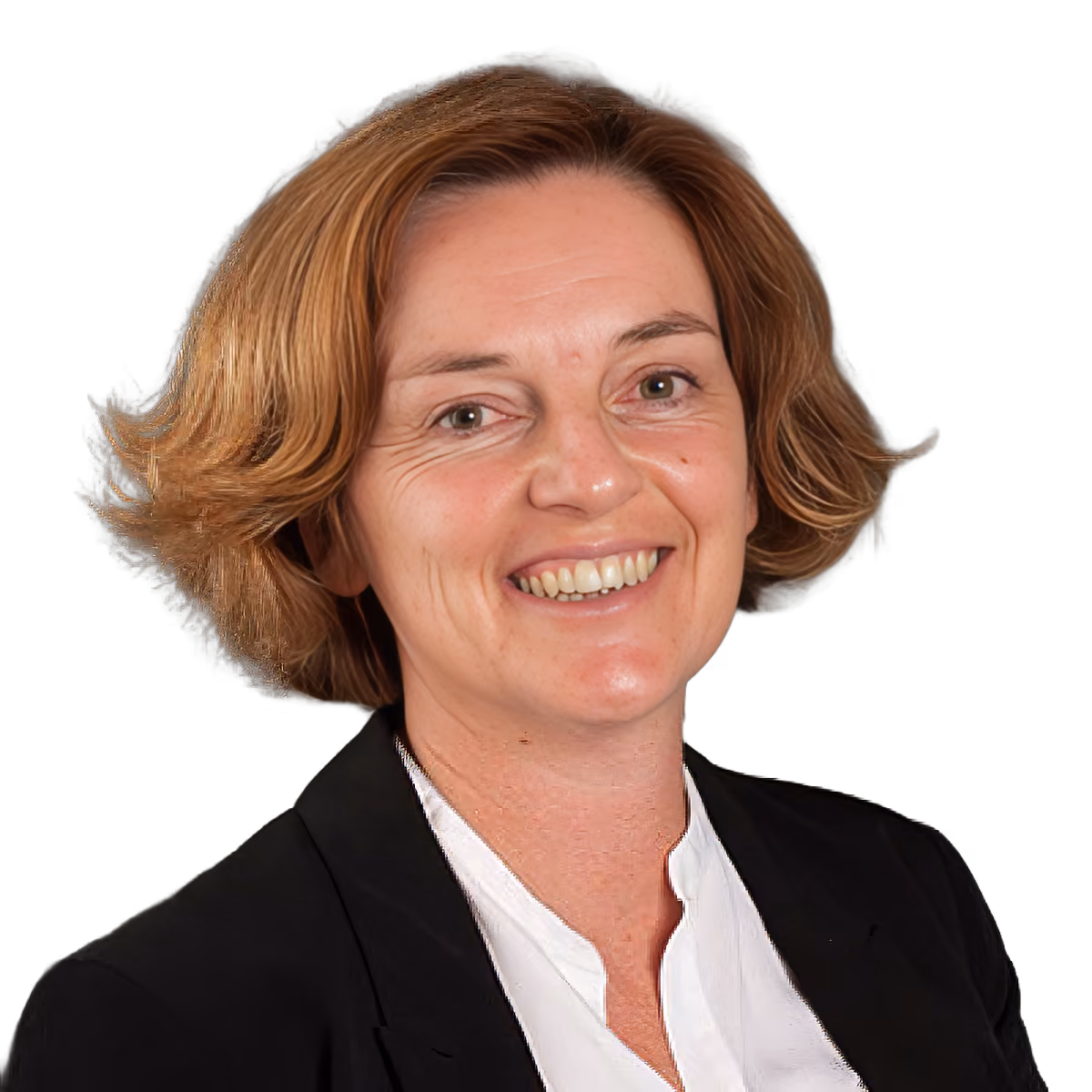 Smiling woman with short light brown hair wearing a black blazer and white blouse, dark background.