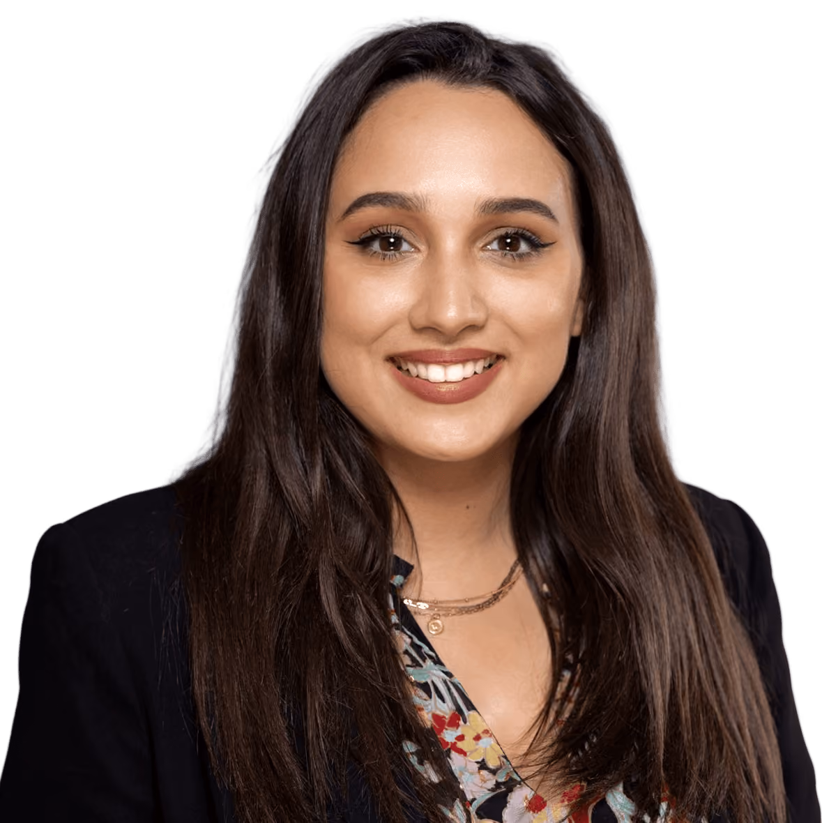 Smiling young woman with long brown hair wearing a floral top and black blazer.