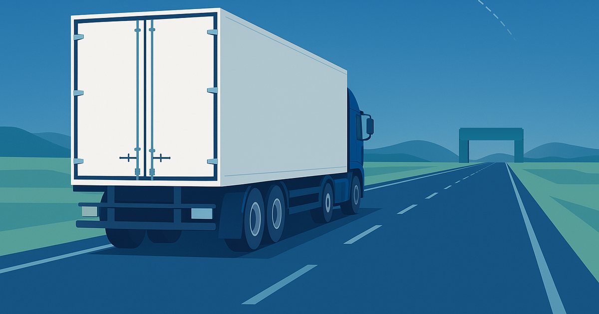 A white semi trailer with sealed rear doors driving an open highway toward a customs gate on the horizon