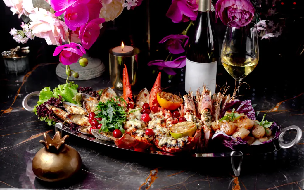 there is a platter of food with shrimp, shrimp, and other foods on it