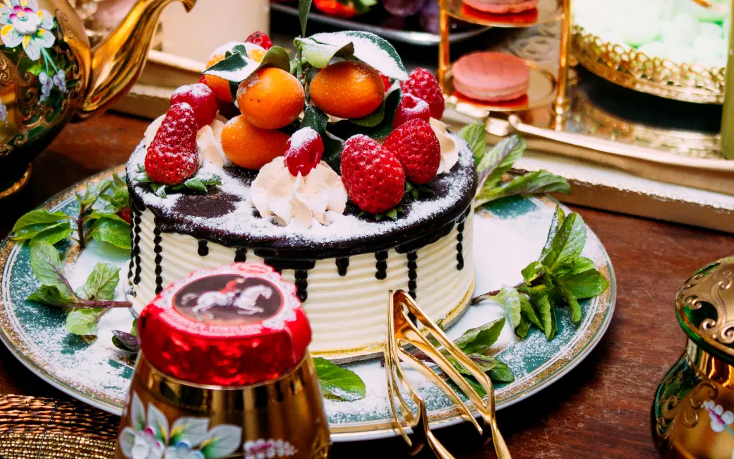 there is a cake with fruit on it on a plate