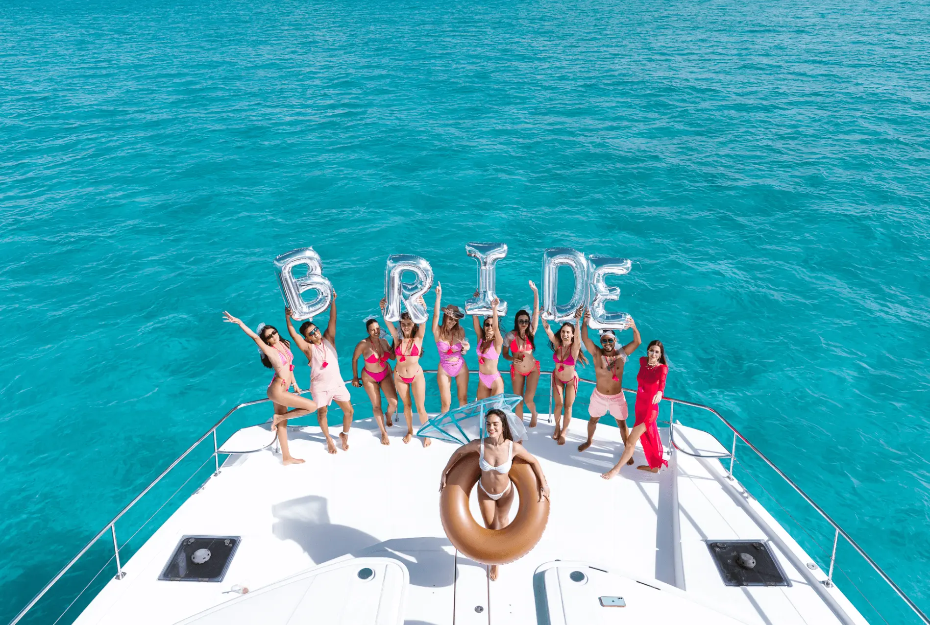 group of people on a boat posing for a picture