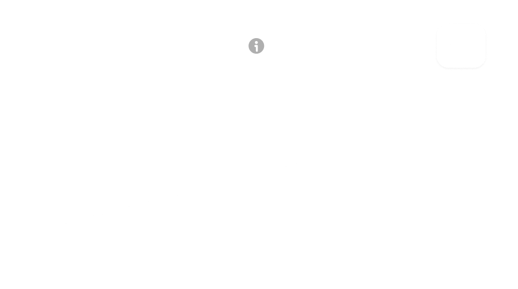 A white wall with a clock on it.