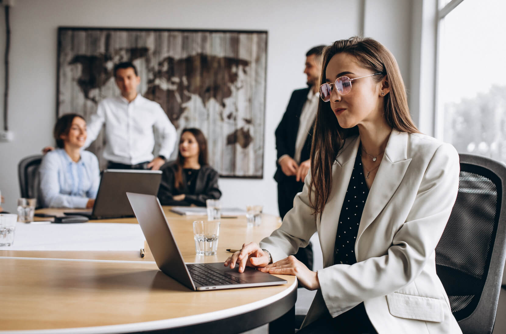 A woman sitting in front of a laptop computer.
