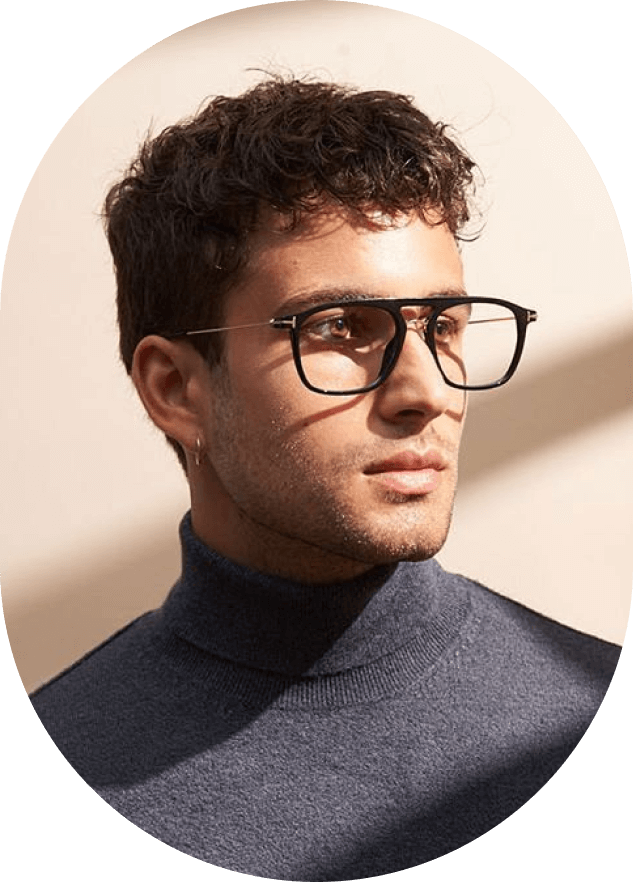 A man wearing glasses and a turtle neck sweater.