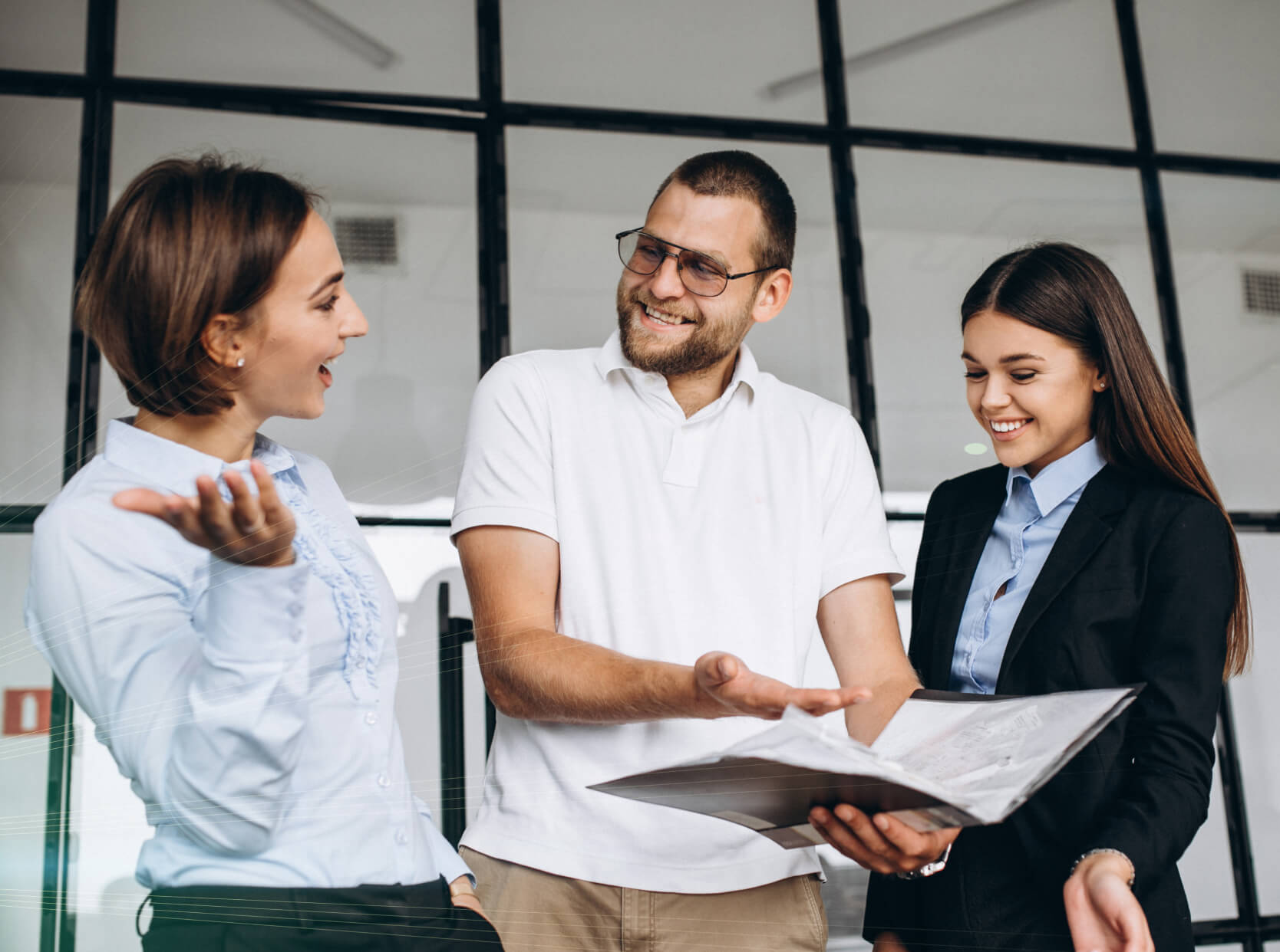 A group of people standing around each other.