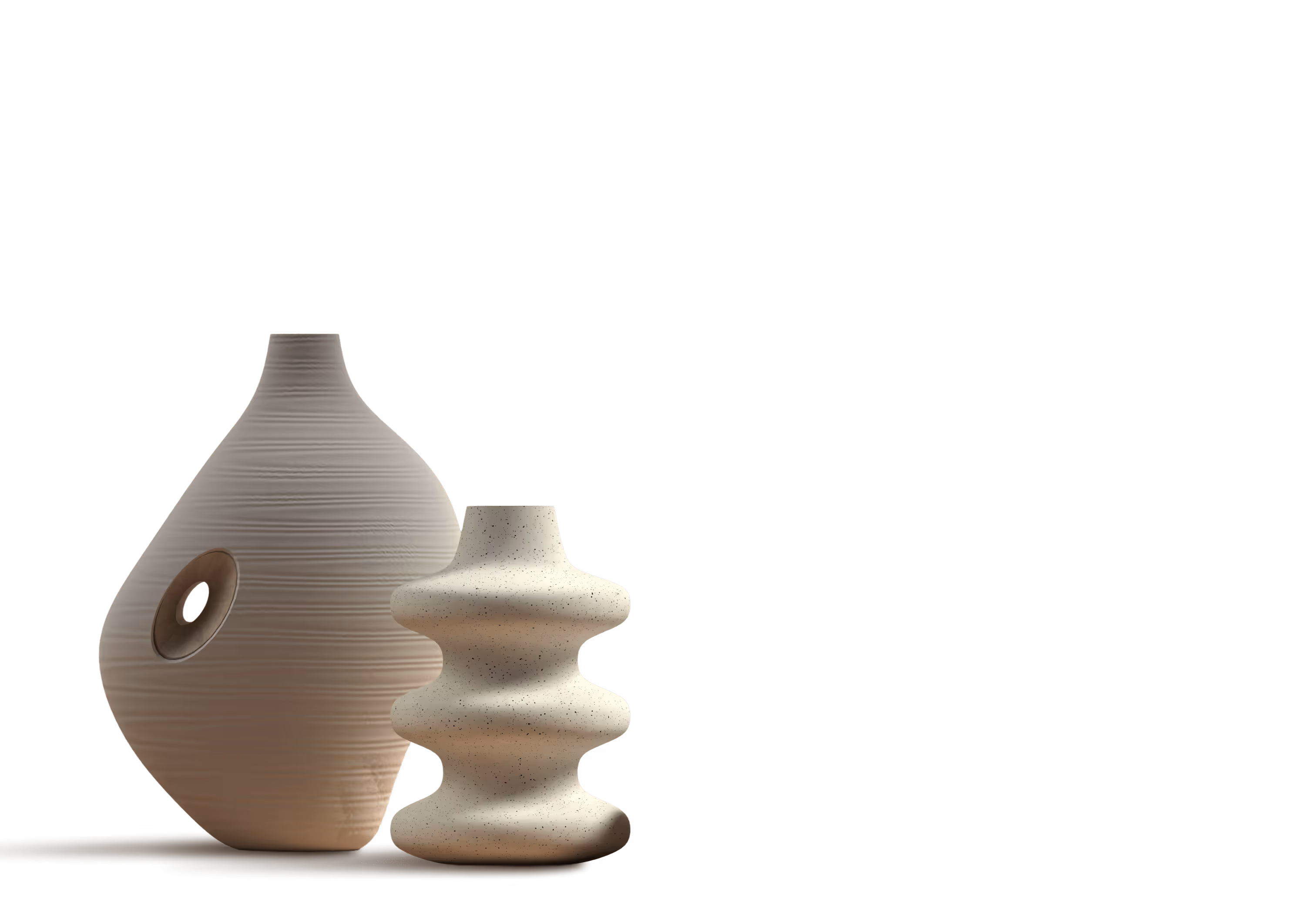 Two modern ceramic vases with unique shapes and neutral tones on a brown surface.
