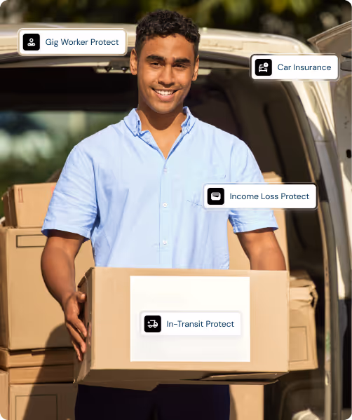 Smiling man in a light blue shirt holding a large cardboard box in front of a van filled with more boxes, with labels indicating Gig Worker Protect, Car Insurance, Income Loss Protect, and In-Transit Protect.