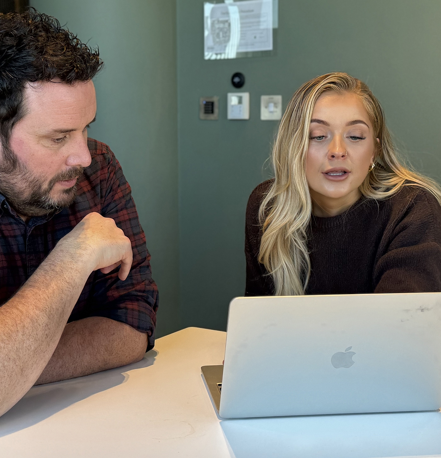 Made.Agency team members working on a project