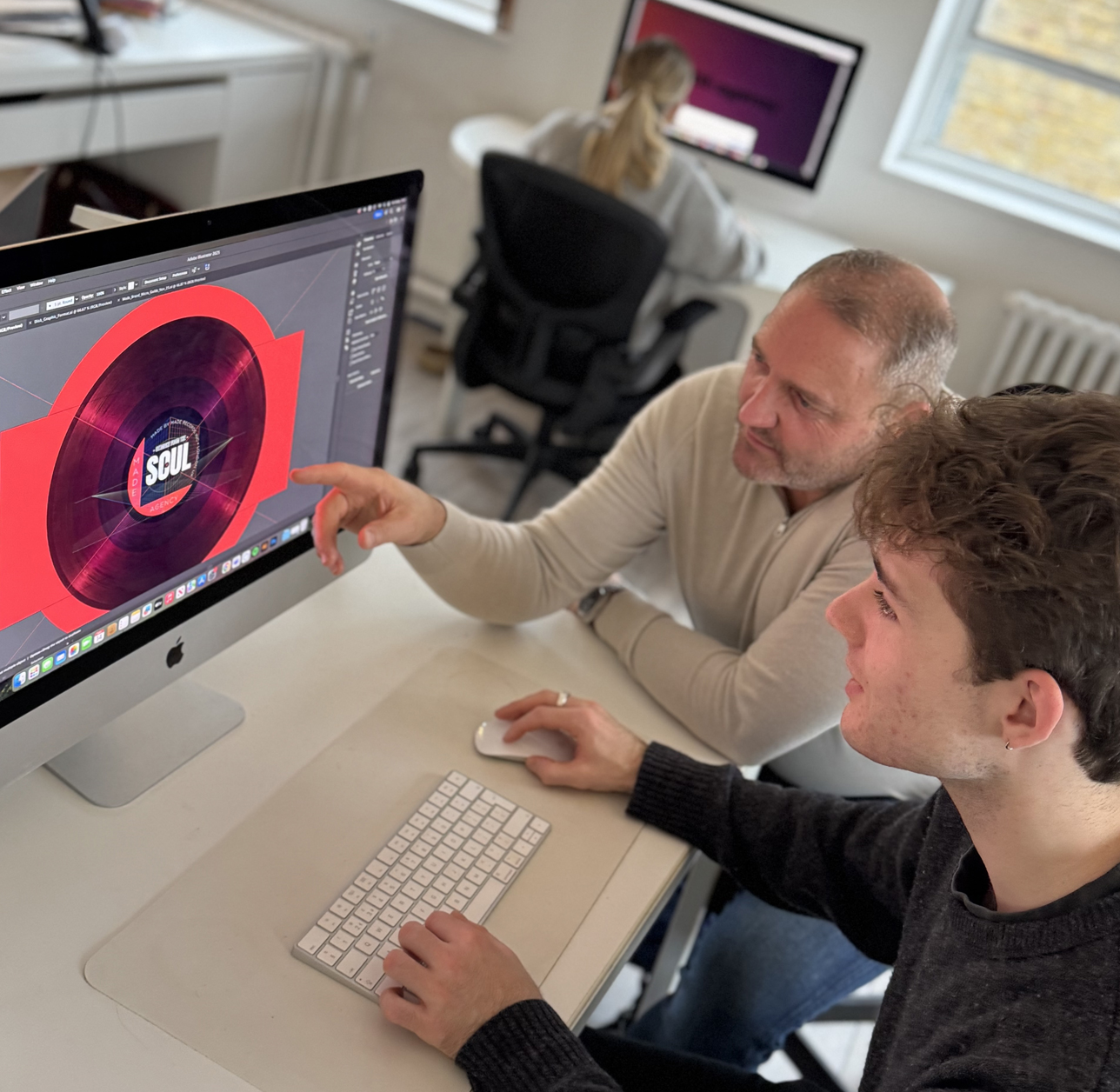 Designers at Made.Agency working in a creative agency environment