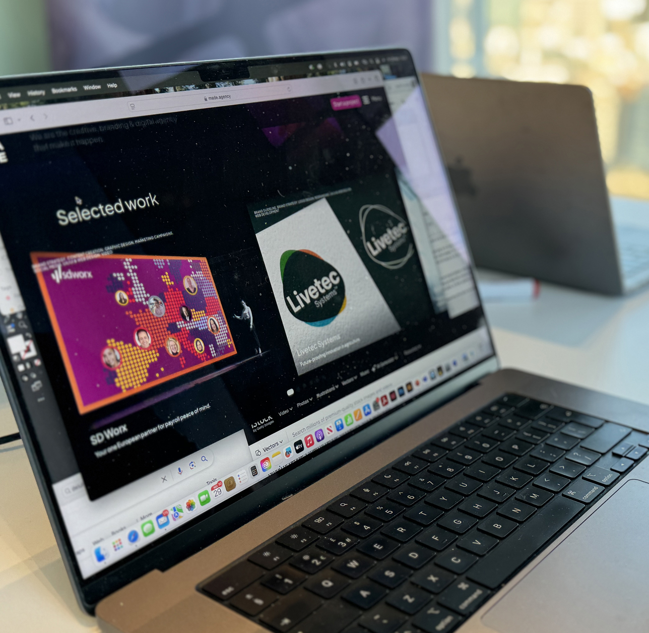 Active laptop screen in a design agency office