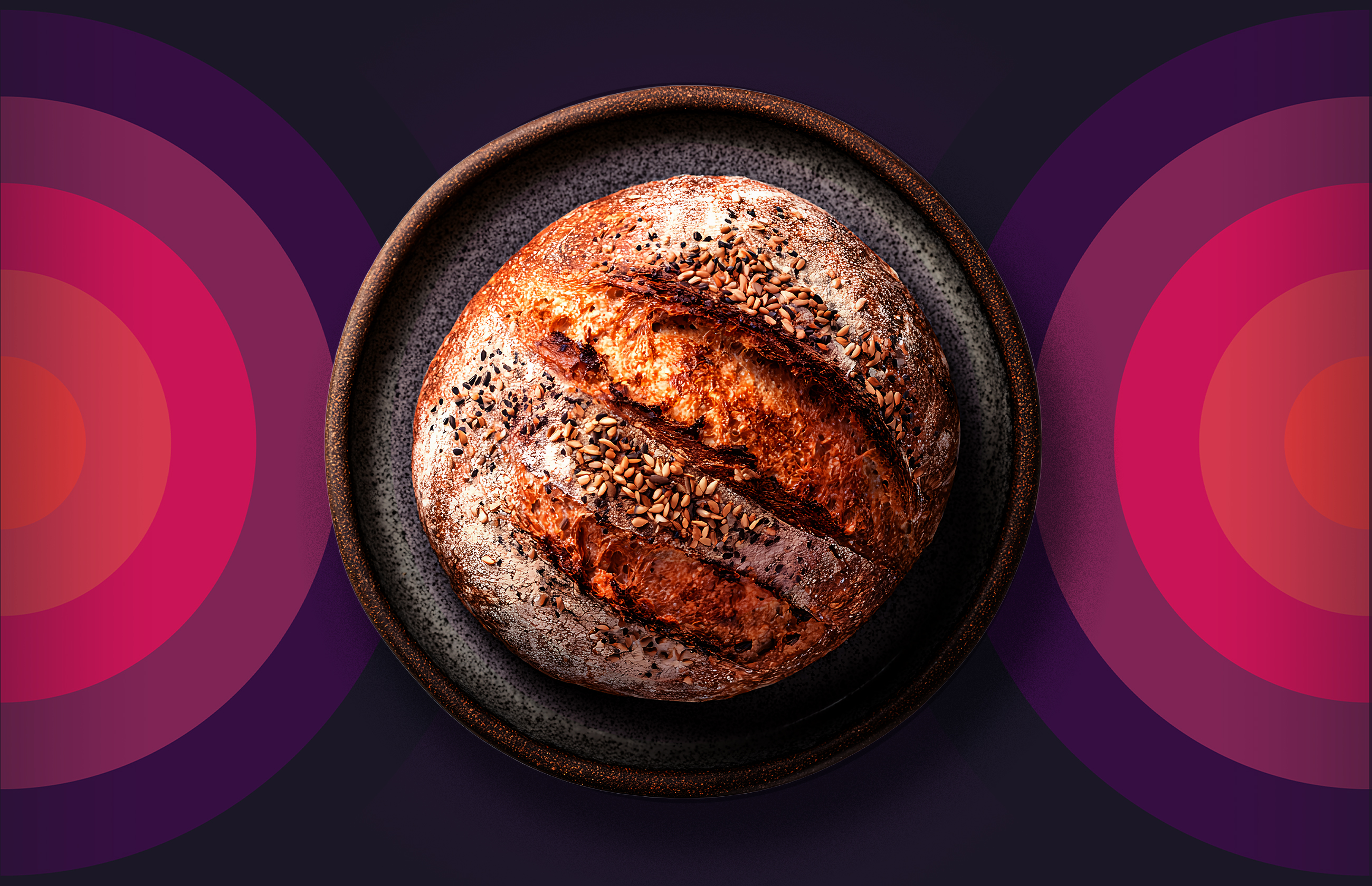 Sitting in the centre of a patterned background sits a crusty sourdough loaf that has obviously been backed with time and care. It's an example of the quiet luxury that sits at the heart of the blog