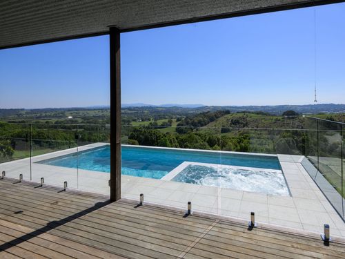 Infinity pool overlooking scenic landscape designed by Living Pools & Spas