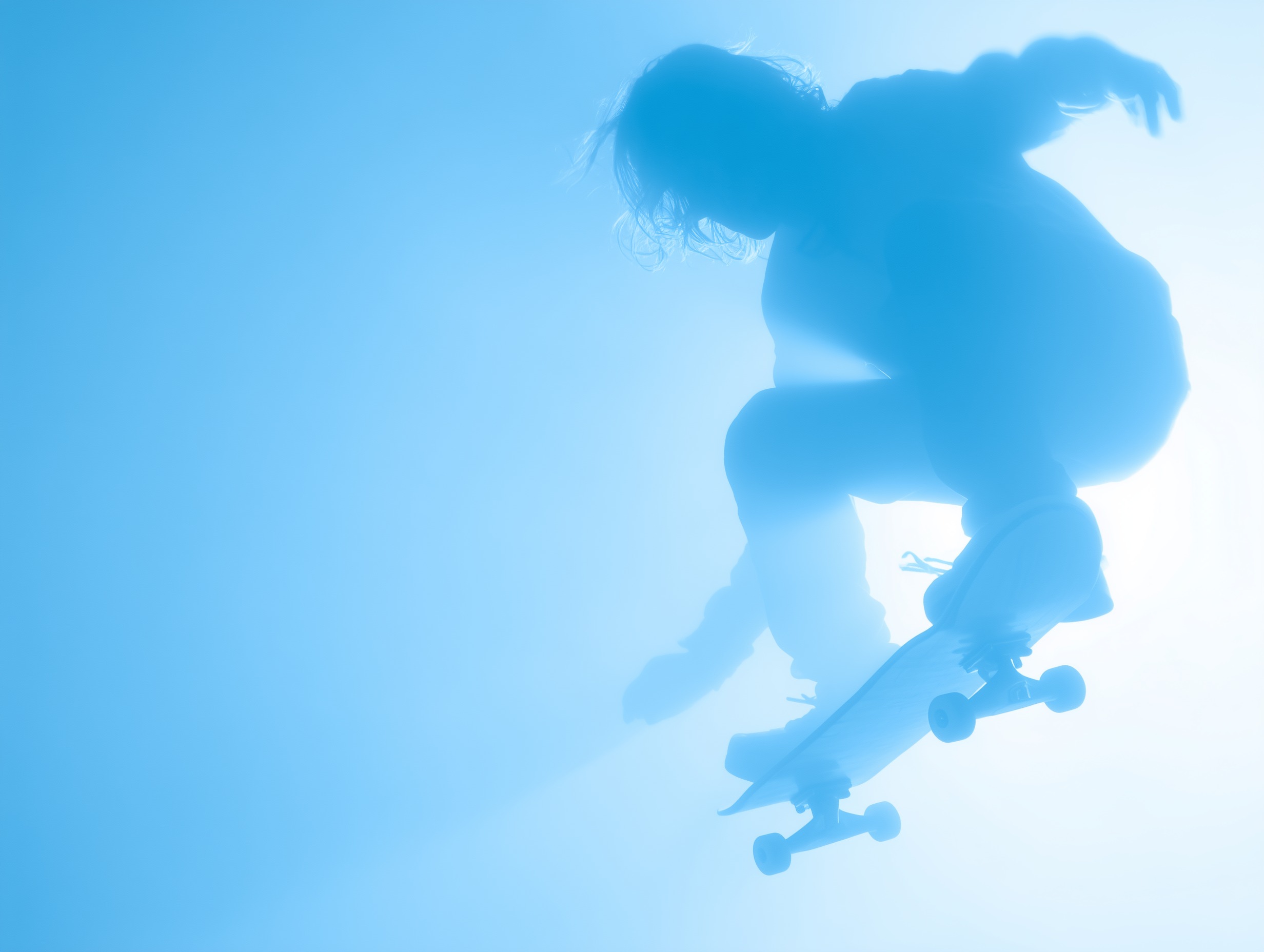 Silhouette of a person mid-air performing a skateboard trick against a bright blue sky.