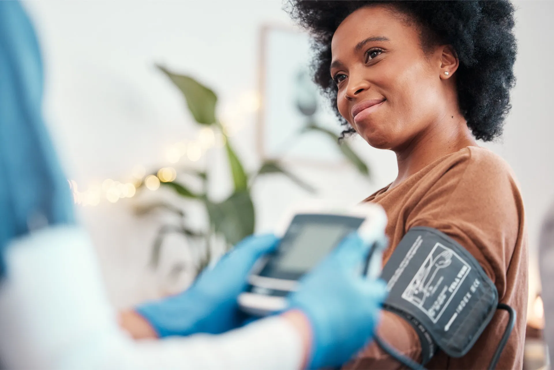 woman wearing blood pressure cuff at South Tampa urgent care facility