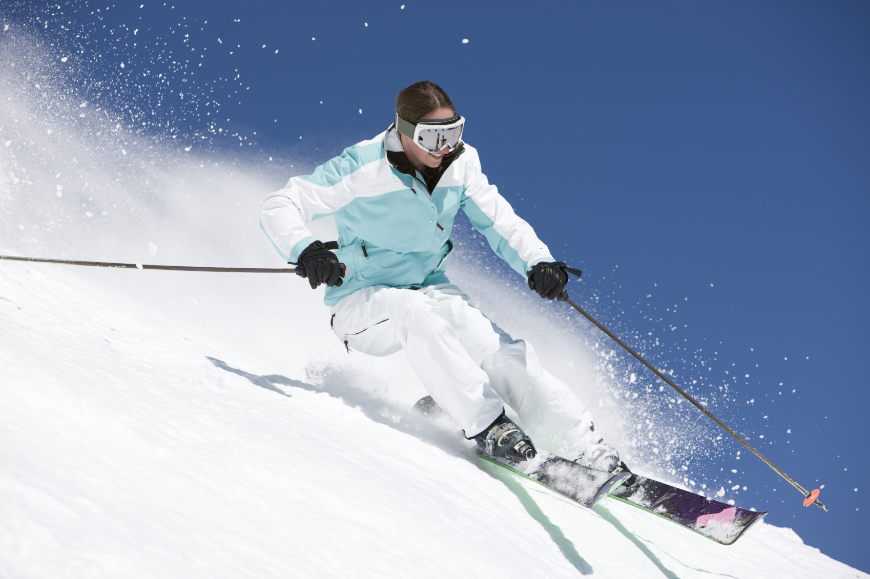 Skier racing down a snowy slope