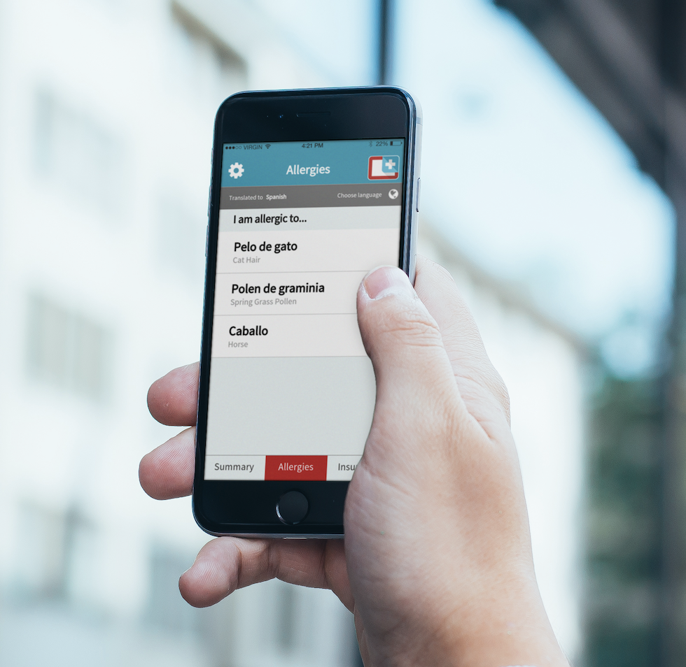 World Medical Card app on a phone held in a city street