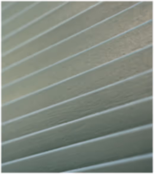 Close-up of a textured surface with evenly spaced horizontal ridges.