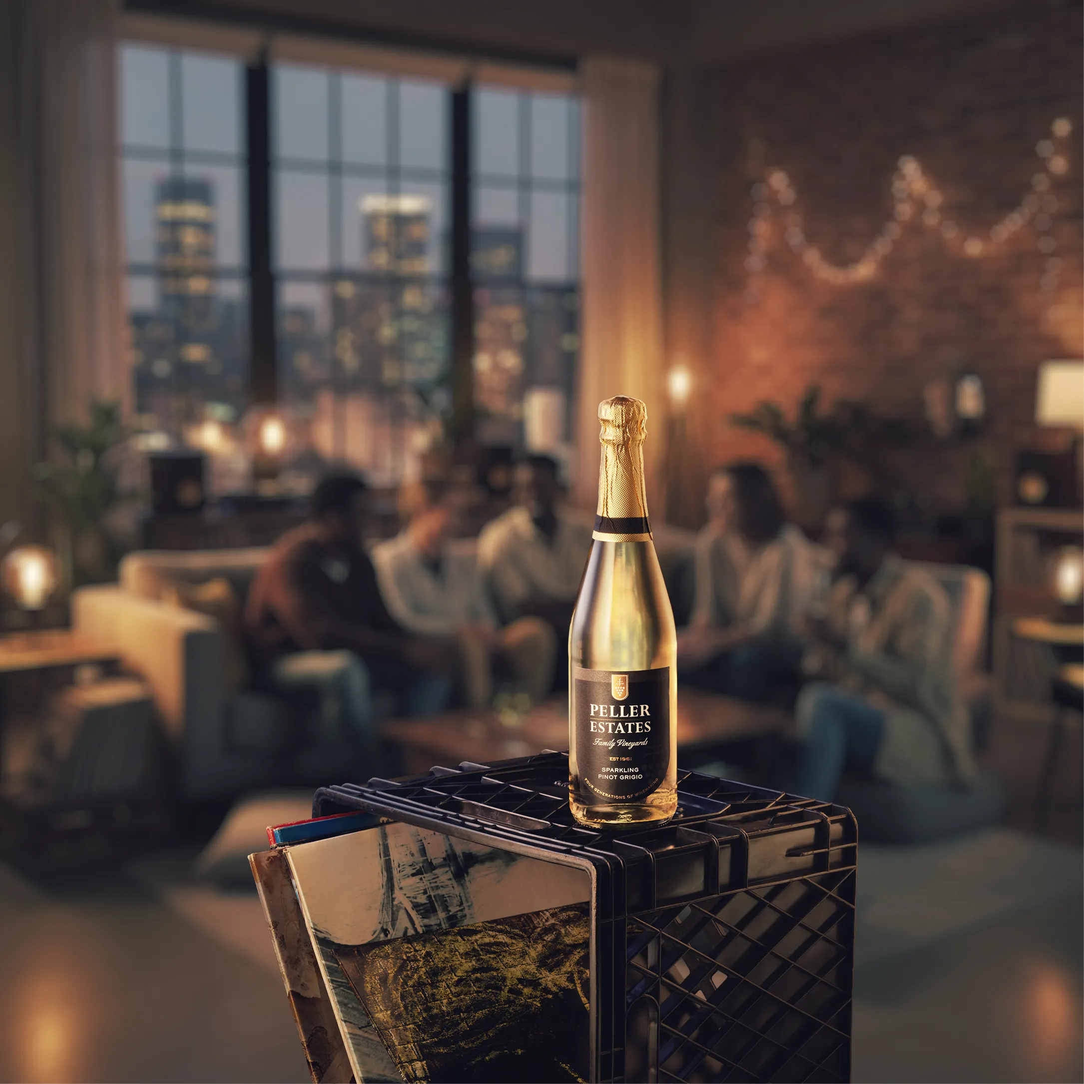 peller estate wine bottle sitting on a record create while in the background a group of friends are handing out in the living room drinking wine. 