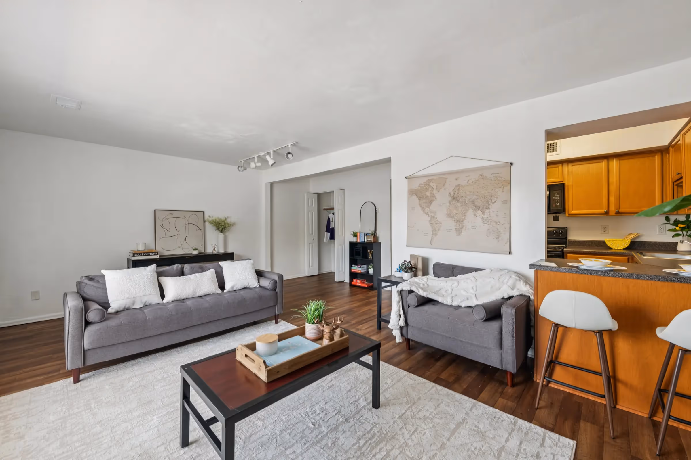 living area with sofa and view into kitchen