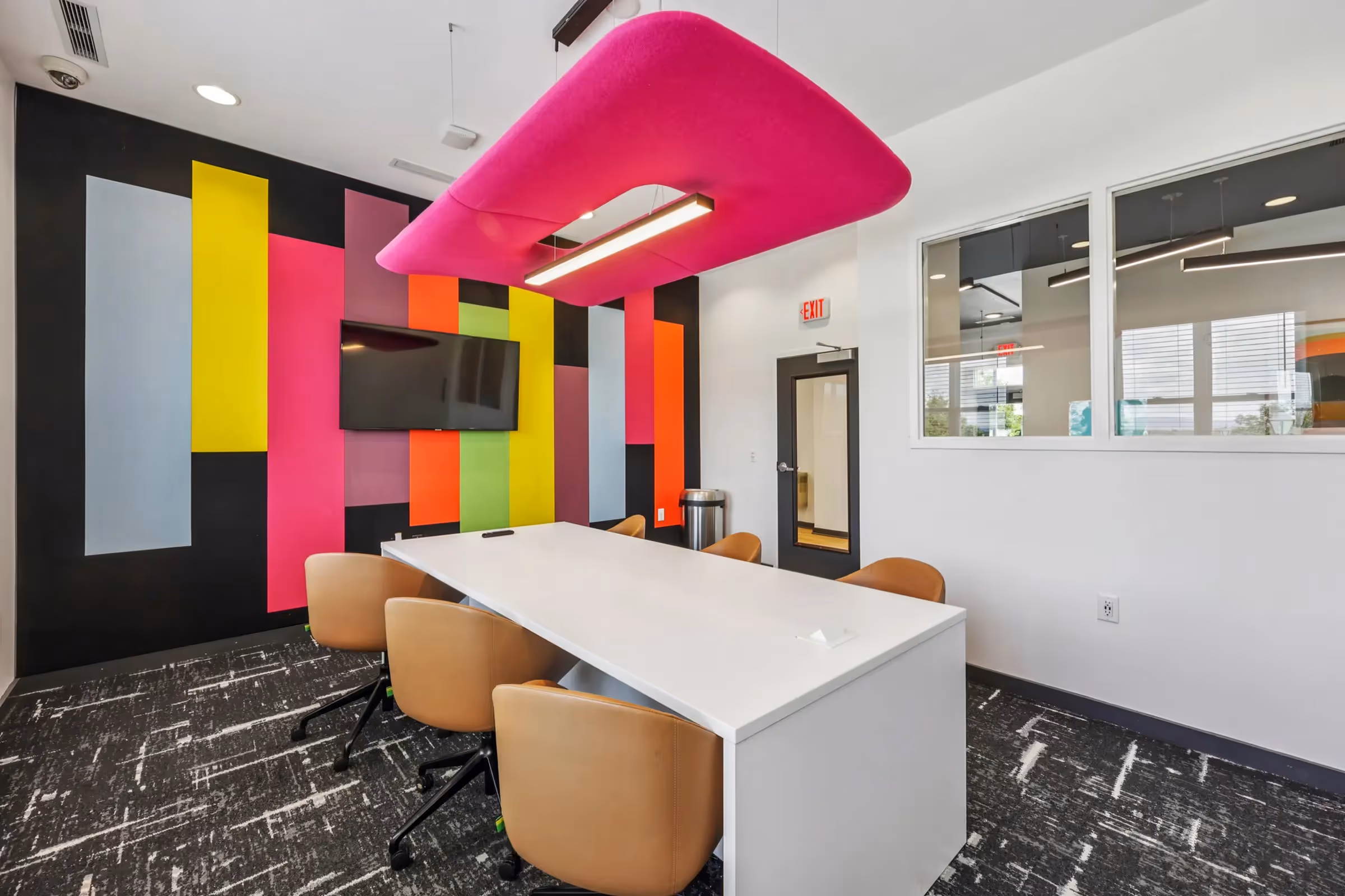 study room with table, chairs, and tv