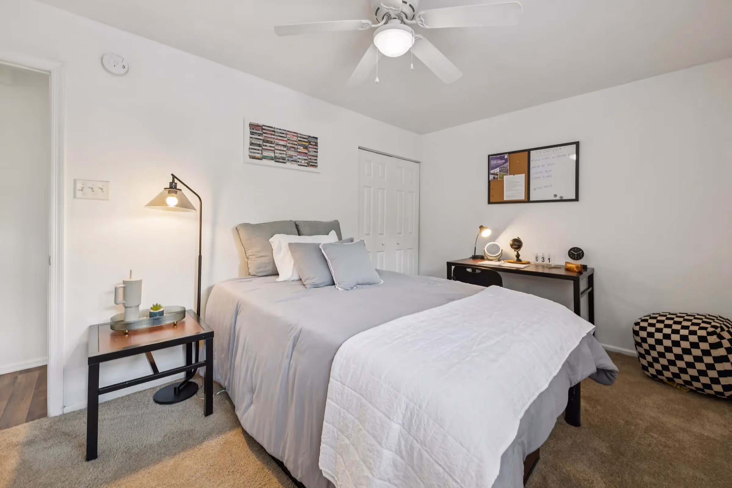 furnished bedroom with bed and desk