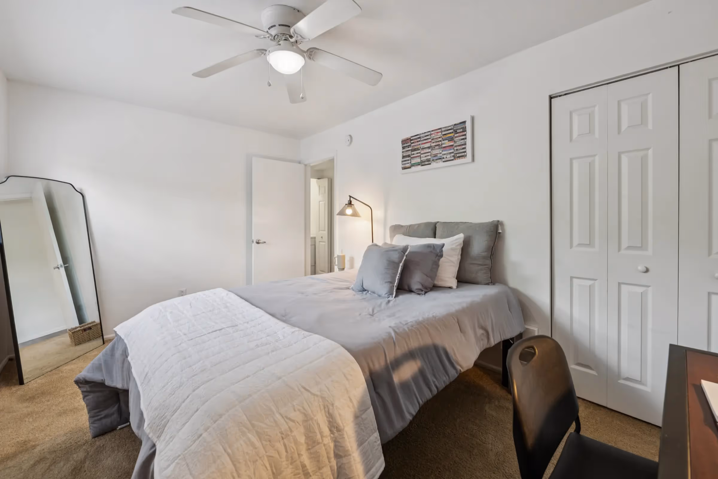 furnished bedroom with bed and desk