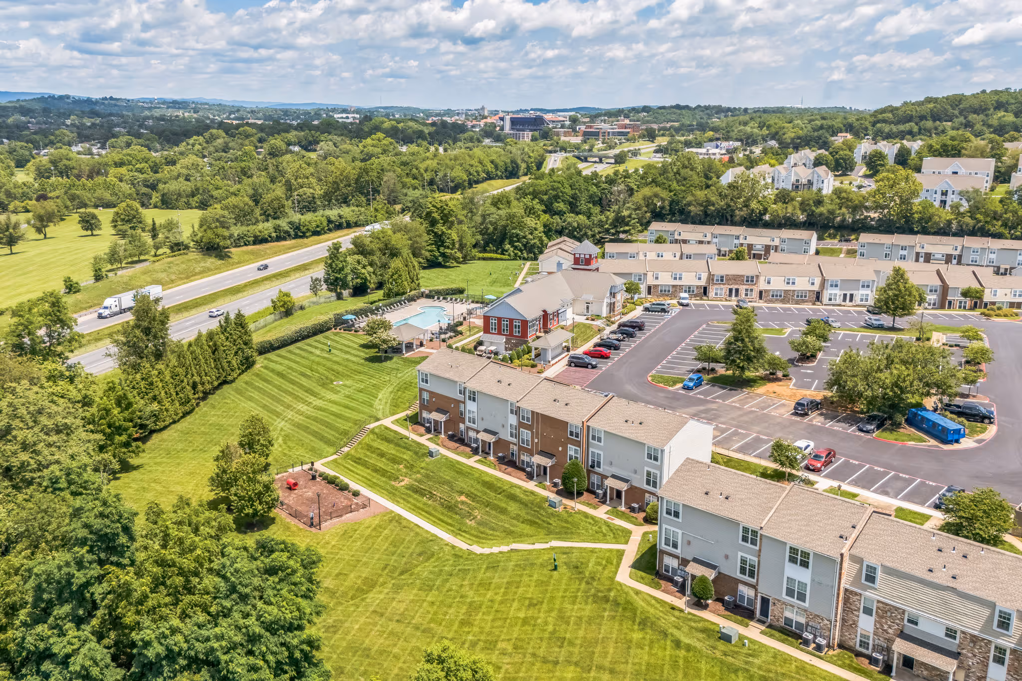 Birds eye view of exterior and surrounding area with trees