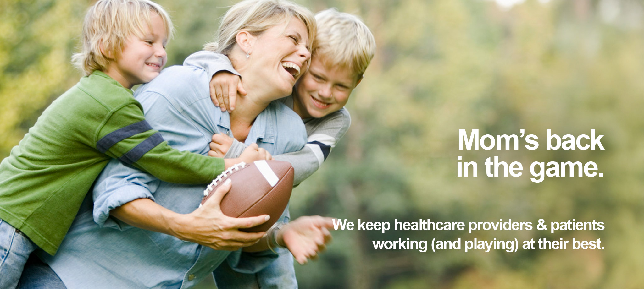 Active mother playing football with her two sons, demonstrating return to physical activities and family play after recovery. Text overlay reads "Mom's back in the game" and "We keep healthcare providers & patients working (and playing) at their best."