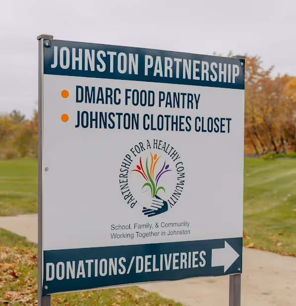 johnston partnership sign leading people to donations and deliveries