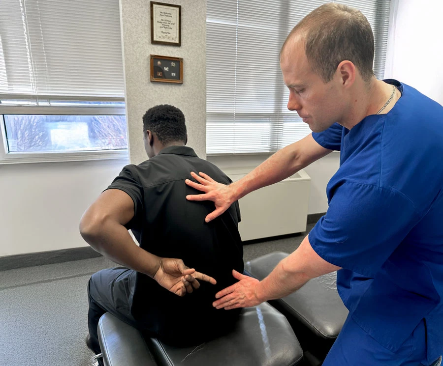 Dr. Armellino working with a patient