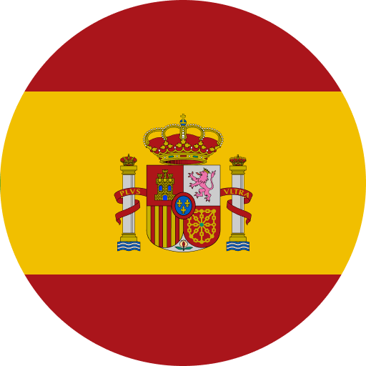 Round image of the Spanish flag with red-yellow-red horizontal stripes and the Spanish coat of arms in the center.